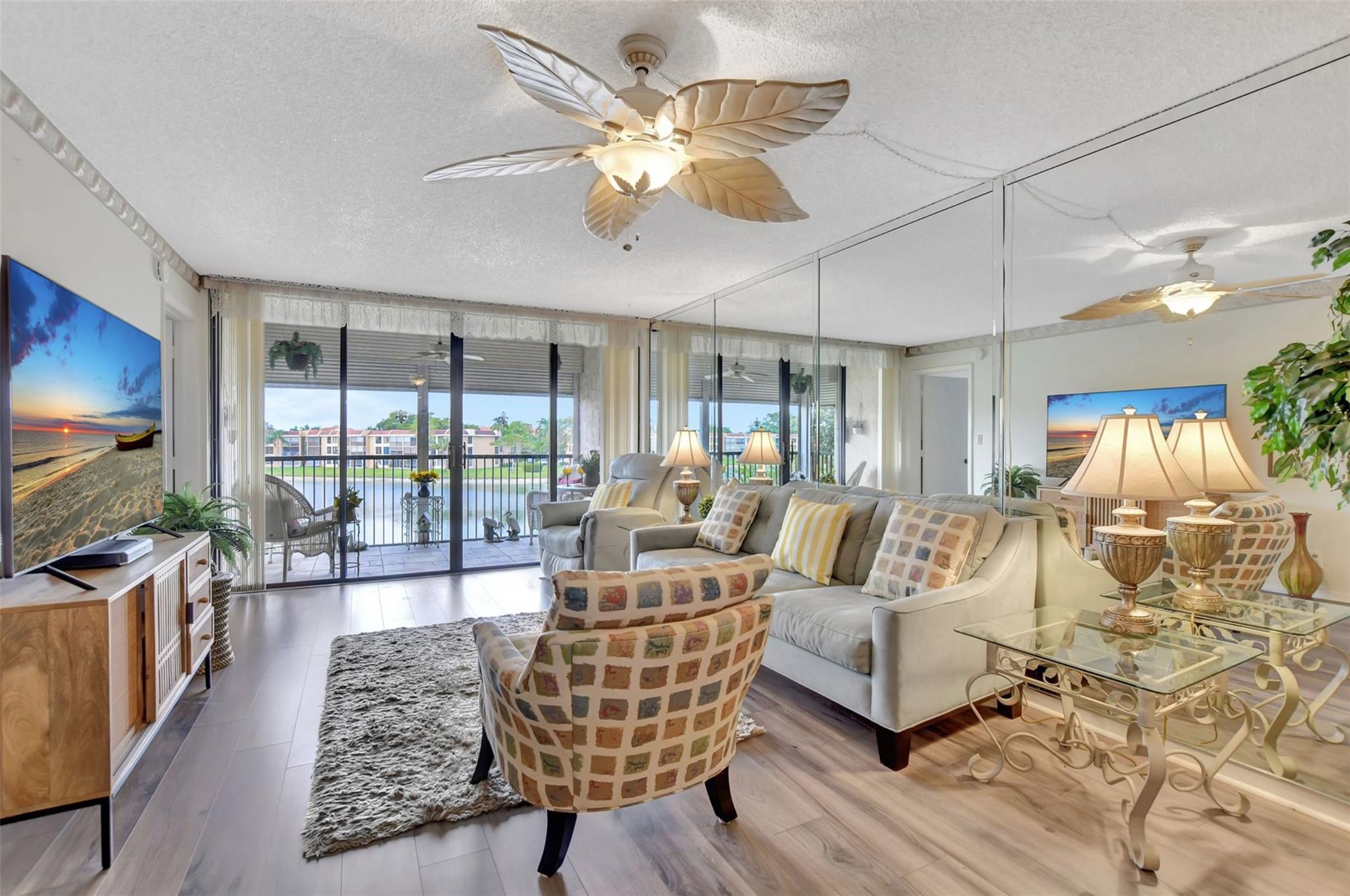 Welcome home to your 2/2 LAKEFRONT HOME in Coral Gate, 55+. Fully furnished! Foyer entry into spacious LA boasting NEW VINYL PLANK flooring. Large LR opens to screened balcony w/ sweeping LAKE VIEWS-perfect for parties. Dining room is ready for family gatherings. Entertaining is a breeze in your large kitchen featuring newer Kenmore appliances & rich 30" cabinets w/ crown molding. Savor morning coffee & endless sunrises in your breakfast nook. Fall in love in the large primary suite w/ IMPACT WINDOW overlooking the LAKE. THREE closets - great for fashion fans. Primary bath w/ a new comfort height toilet & stall shower to wash away your stress. Long vanity w/ make-up station. Guest BR has plush carpet. Guest bath has a tub to soak away your worries W/D IN UNIT. NEW A/C SYSTEM! NEW HWH!