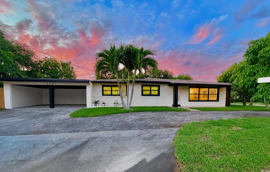 Fully renovated 4BR/3BA corner lot home with no HOA, just minutes from the beach, Atlantic Ave, Downtown Boynton Beach, and I-95. This move-in ready property has been completely reimagined from top to bottom, offering the feel of brand-new construction in one of South Florida's fastest-growing coastal areas. Inside, enjoy over 2,000 sq ft of open-concept living space featuring new tile flooring, oversized baseboards, solid shaker doors, and high-end finishes throughout. The chef-inspired kitchen is the centerpiece of the home with custom hardwood cabinetry, premium stone countertops, induction cooktop, double oven, built-in microwave, French door refrigerator, and stylish mini bar. This home features two en-suite bedrooms, including a spacious primary suite with a  beautifully renovated bathroom. The oversized private yard offers plenty of room for a boat, pool, fruit trees, or future outdoor entertaining space. Fresh grass and lush landscaping create outstanding curb appeal.  Ideal as a primary residence, vacation home, or investment property with excellent Airbnb potential.