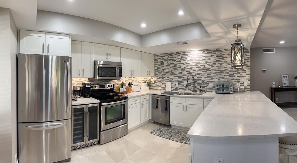 Photo of 431 Brackenwood Lane N, Palm Beach Gardens, FL 33418 (MLS # R11009962)