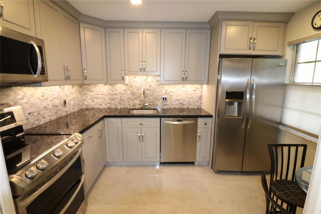 Photo of 4020 W Palm Aire Drive #412, Pompano Beach, FL 33069 (MLS # F10425528)