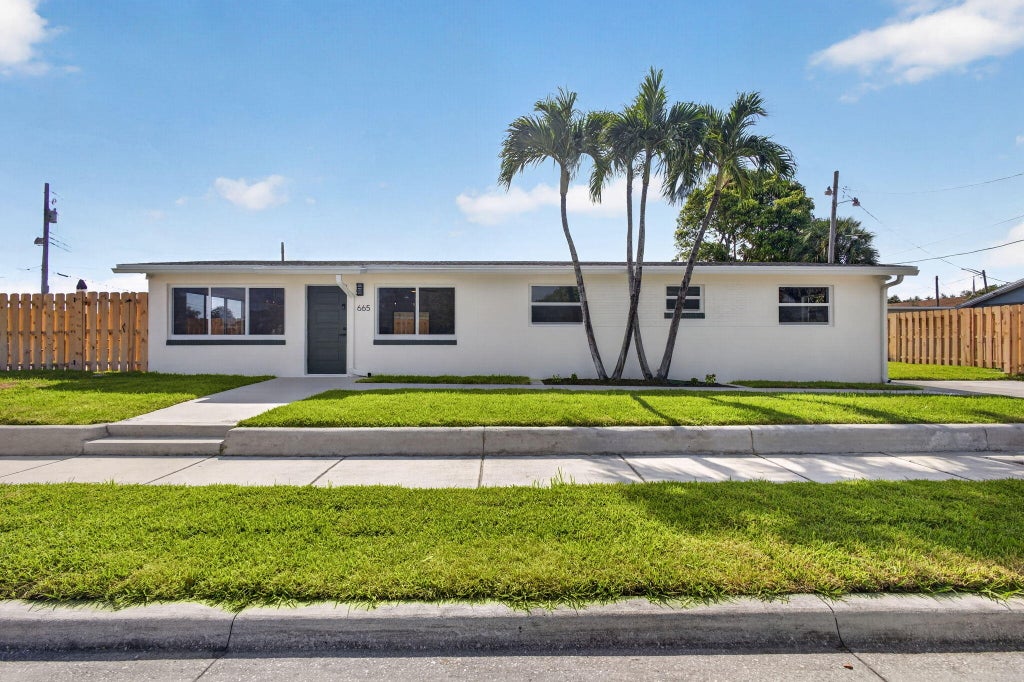 Photo of 665 W 7th Street, Riviera Beach, FL 33404 (MLS # B26042696)