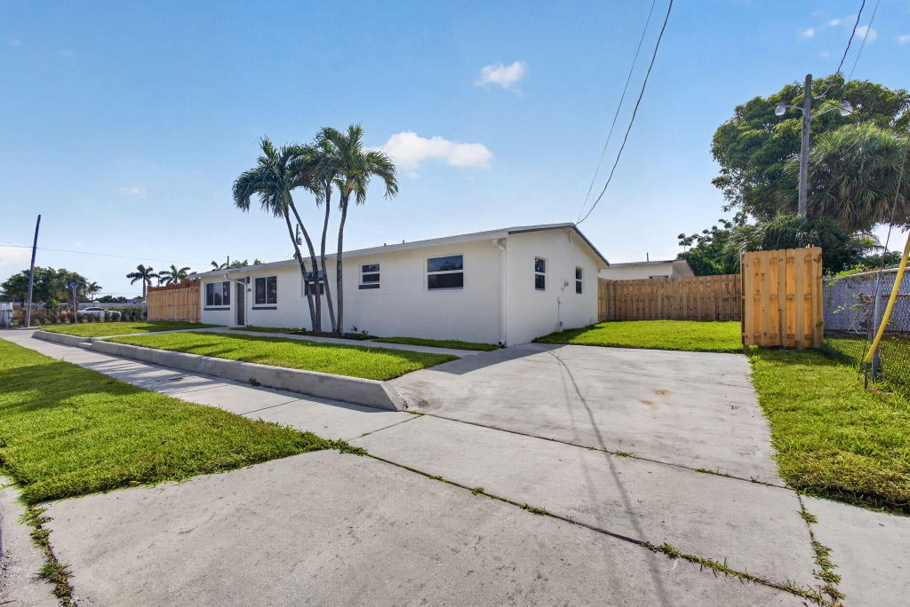 Photo of 665 W 7th Street, Riviera Beach, FL 33404 (MLS # B26042696)