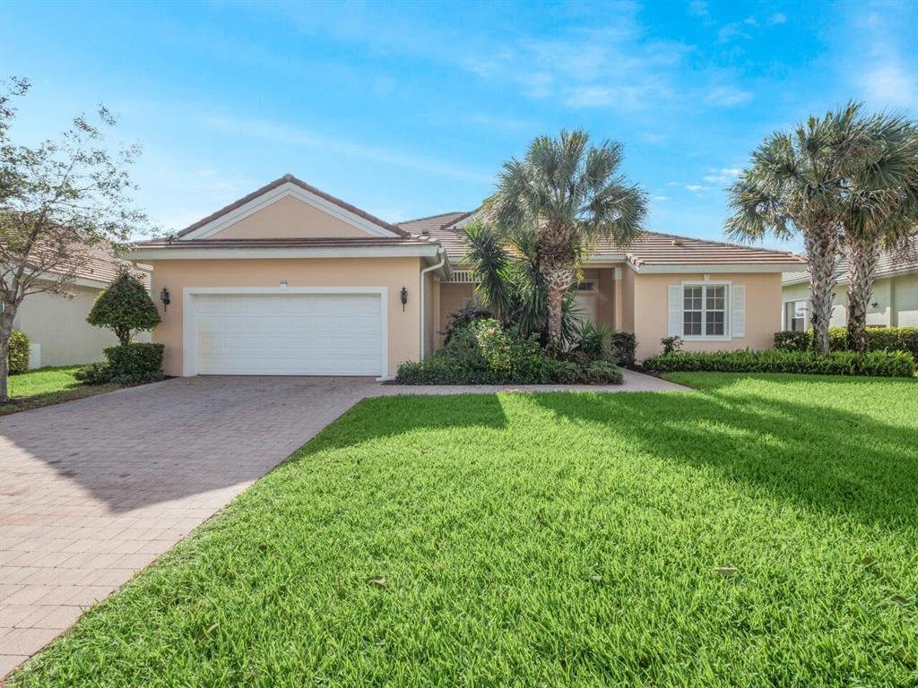 Photo of 166 NW Magnolia Lakes Boulevard, Port Saint Lucie, FL 34986 (MLS # R10786823)