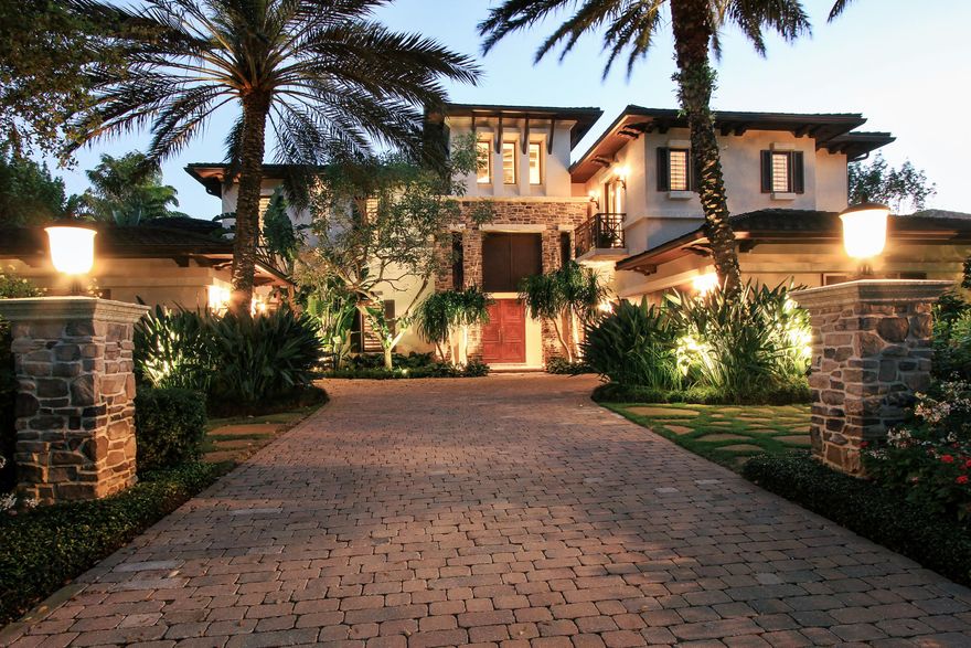 Extraordinary offering of a rare special home that combines Zen serenity with matchless beauty. Detailed blend of luxury materials complimented by one of Admirals Cove BEST Southern expansive waterviews from every room. Designed using clean lines, neutral palate and judicious mix of marble, stone, metals and wood, this home is warm, modern and classically timeless. Disappearing glass sliding doors let the outside in revealing interior waterfall rock gardens, waterviews, flowering gardens. Soaring ceilings accented w/pecky cypress crossbeams create a rich warm ambiance. Impressive 2 story entry foyer. Home designed in a U Shape, w/waterfall rock gardens in the center. First floor mini MBR and bath w/private sliding doors to the water gardens. Unsurpassed dream chefs kitchen outfitted w/Leeds custom cabinetry, 60" Wolf range, a matched pair of 36" Subzero refrigerator/freezers, Subzero warming drawer. Bookended by rock pillars, the vast granite center island offers Subzero steamer, wine cooler and 2 Bosch dishwashers. Two pantries w/pullouts.  Intimate Breakfast Room overlooking nature bird sanctuary. Spanning a 25 ft Great Room w/ vaulted ceiling, wood built-in TV wall, matched set of niched hand carved wood cabinets are vanishing glass doors revealing infinity edge pool, stone spa, dual fireplace. Separate music room/cocktail lounge w/built-in bar opens to dripping rock waterfalls. Her office w/groin ceiling/built-ins. His 2 story paneled club room with walls of glass.  The two offices share a powder room encased  w/onyx slabs. Enormous MBR suite opens w/frosted glass doors. Huge balcony overlooks expansive water views/bird sanctuary.  Luxurious bath w/Calcutta gold slab covered walls, wood pillars framing the spa bath, full double shower wall w/water views. Alabaster/nickel chandelier. Separate water closets. Full Room Size fitted closet w/separate shoe closet. Large loft w/full bar leads to 2 VIP guest rooms ensuite w/balconies. Paneled elevator. 24 x 24 stone floors. Second  powder w/room onyx countertop, Lalique fixtures, and rock crystal cabinet handles. Extensive summer kitchen. Composite dock w/large lift. Room for LARGE yacht with 111 ft of private water frontage.  Lush specimen landscaping throughout entire grounds.