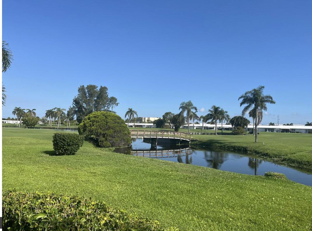Delightful Florida renovated residence with expanded back patio that faces NORTH and overlooks the canal and golf course. This upgraded home is also located on a corner and oversized lot lending an airy and bright ambiance. Great for morning tea and al fresco dining.. Upgrades include ceramic tile, high hats,floating vanities, windowed, walk in Master closet, tray ceilings, whirlpool tub and service bar with running water. PBL is a highly desirable 55+ community that offers FREE 18 hole (Par 3) golf, 3 clubhouses, gym, 3 pools, whirlpool, and numerous activities. Close to I95, restaurants, shops and beaches. This is Florida living at its affordable best