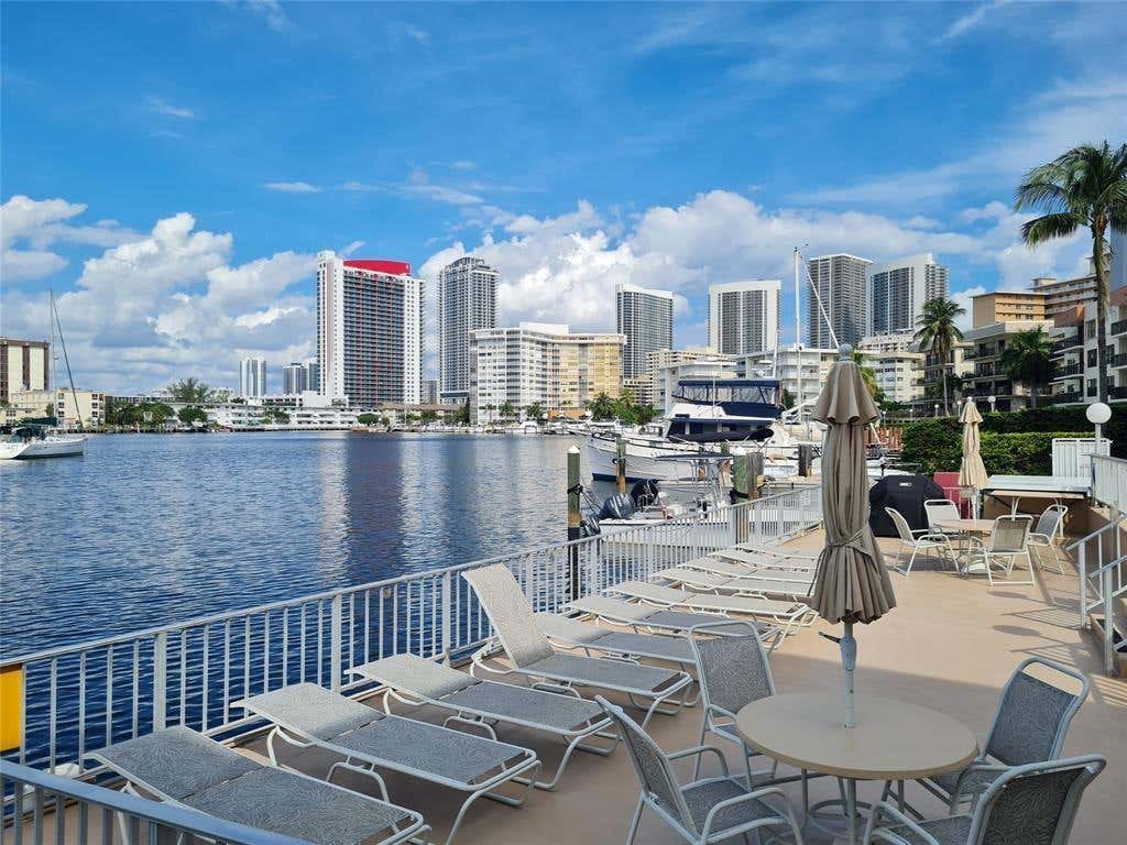 Photo of 300 Golden Isles Drive #104, Hallandale Beach, FL 33009 (MLS # B26062558)