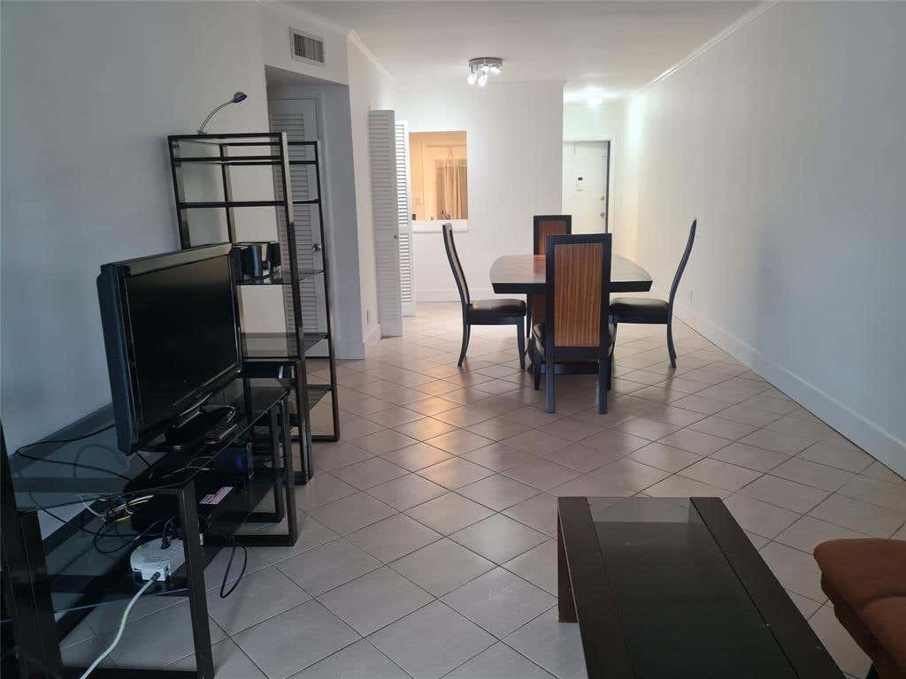 Photo of 300 Golden Isles Drive #104, Hallandale Beach, FL 33009 (MLS # B26062558)