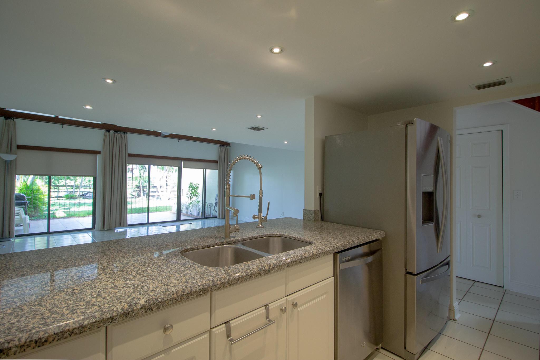 Impeccable two bed/two bath in the heart of Wellington. Upgraded kitchen and baths, outdoor covered terrace, perfect for entertaining and generous backyard overlooking the canal. Live in Wellington and enjoy everything this amazing community has to offer, including one of the best school districts in the area.