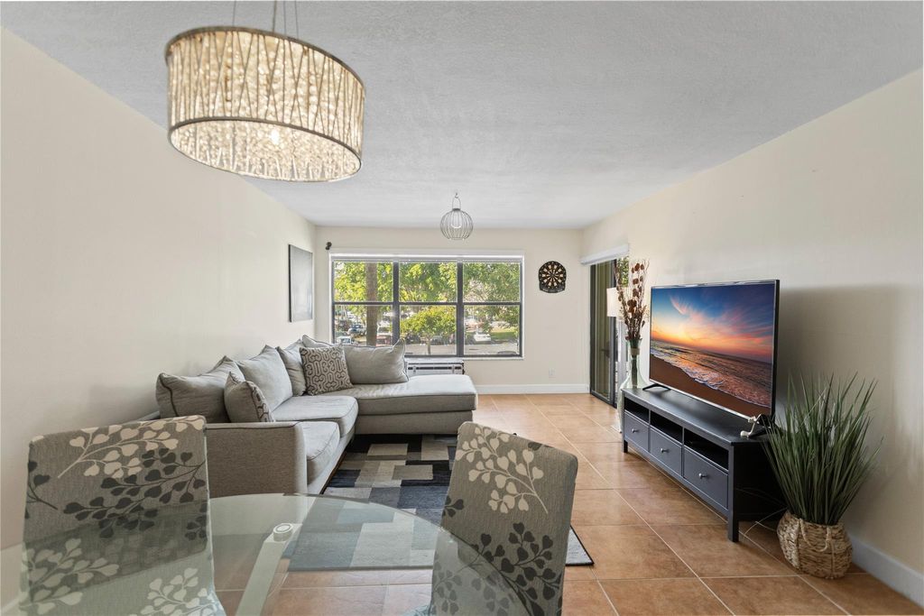 Photo of 2312 S Cypress Bend Dr #205, Pompano Beach, FL 33069 (MLS # F10540966)