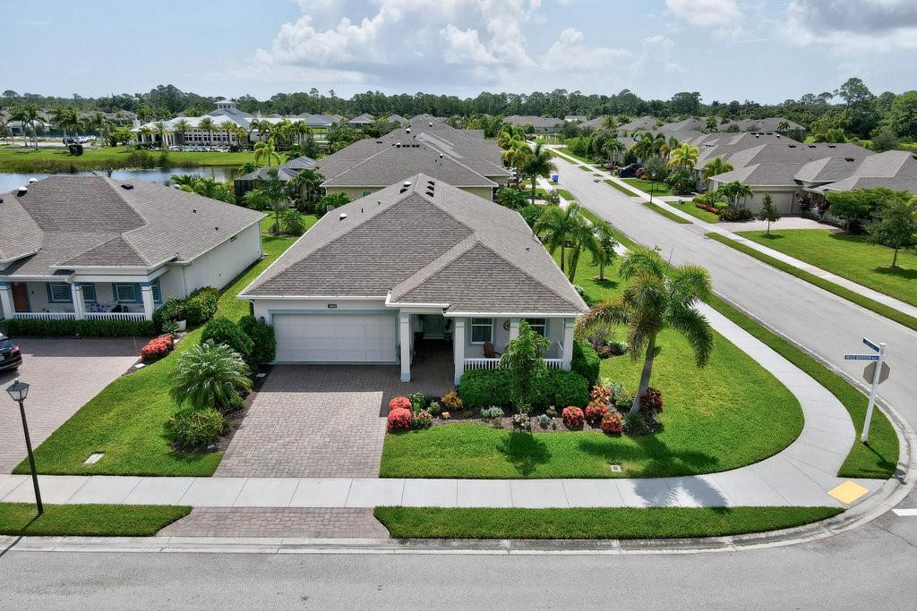 Discover Harmony Reserve, a 55+ community w/upscale amenities & nestled within a tranquil upland Preserve. This 2019-built home, positioned on a coveted corner lot, has amazing pond & fountain views w/meticulously landscaped grounds. The 3-bed/2-bath home spans 2,050 sq ft where modern elegance meets functionality. Island kitchen with nat. gas cooking & wood cabinetry. Plank tile floors, crown molding, recessed lights & abundant ceiling fans create an ambiance of refined comfort. Impact windows, StormSmart Hurricane Screens & Generac generator ensure your home is as secure as it is beautiful.