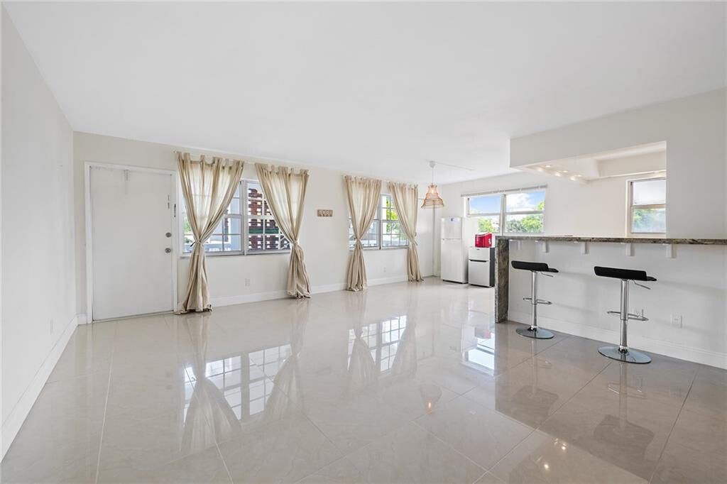 Photo of 5201 NE 24th Terrace #A201, Fort Lauderdale, FL 33308 (MLS # R11165929)