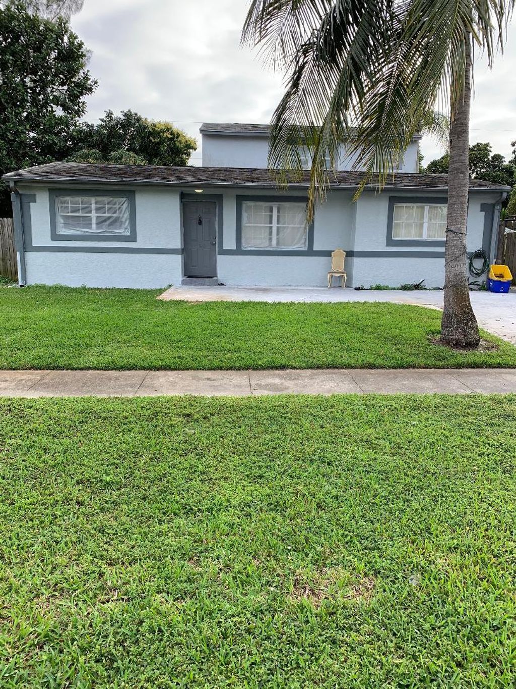 Photo of 580 Tallulah Road Rd, Lake Worth Beach, FL 33462 (MLS # R10767550)