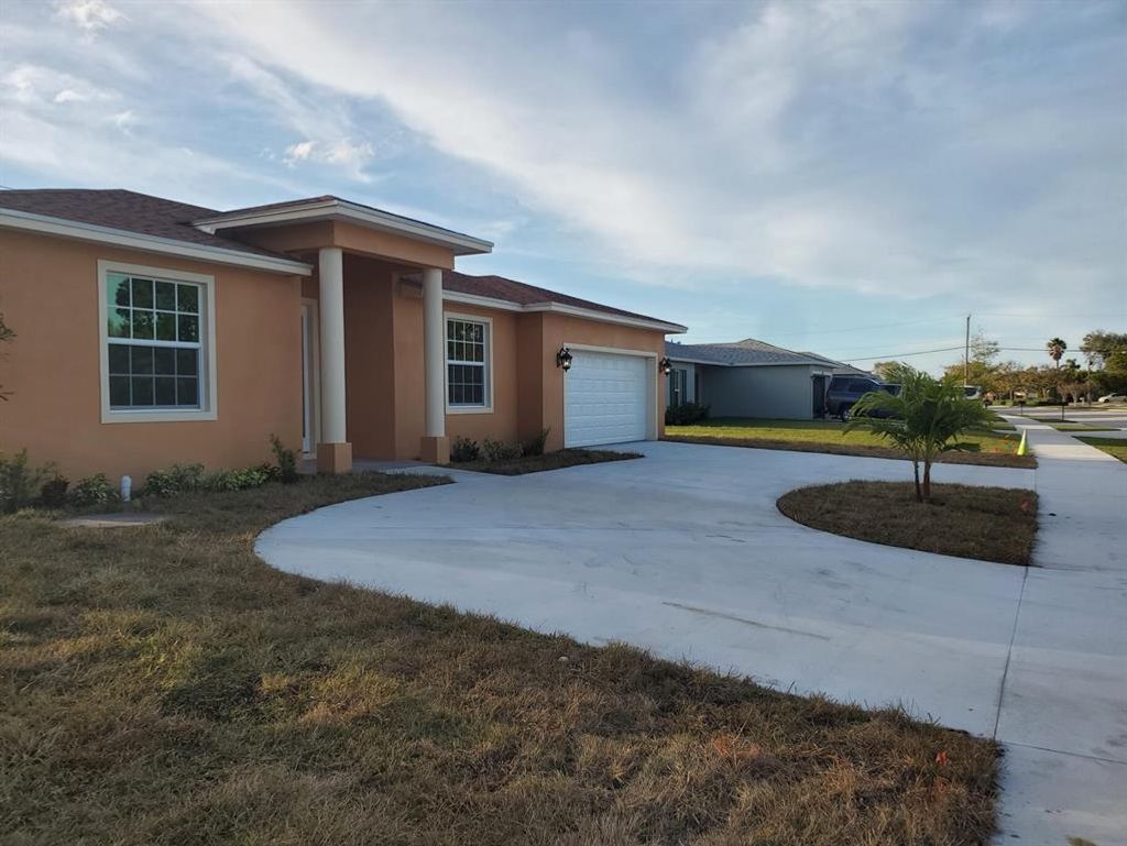 Photo of 422 NW Airoso Boulevard, Port Saint Lucie, FL 34983 (MLS # R10778451)