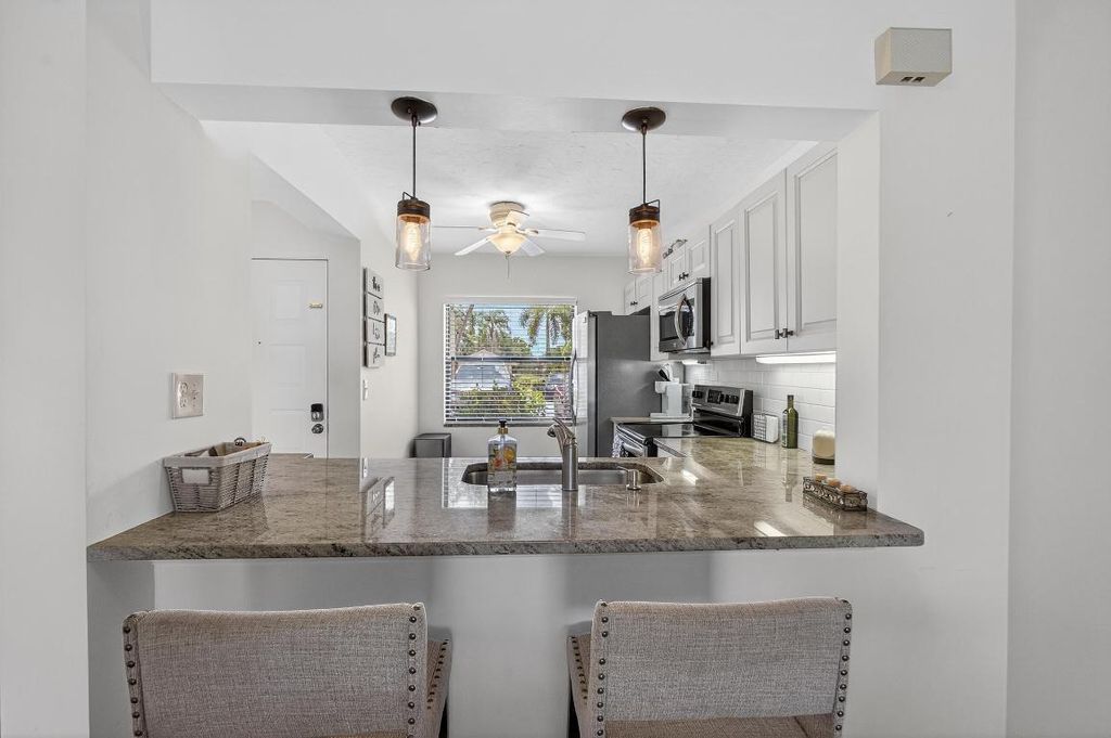 Photo of 12790 Briarlake 103 Drive #103, Palm Beach Gardens, FL 33418 (MLS # R11116409)