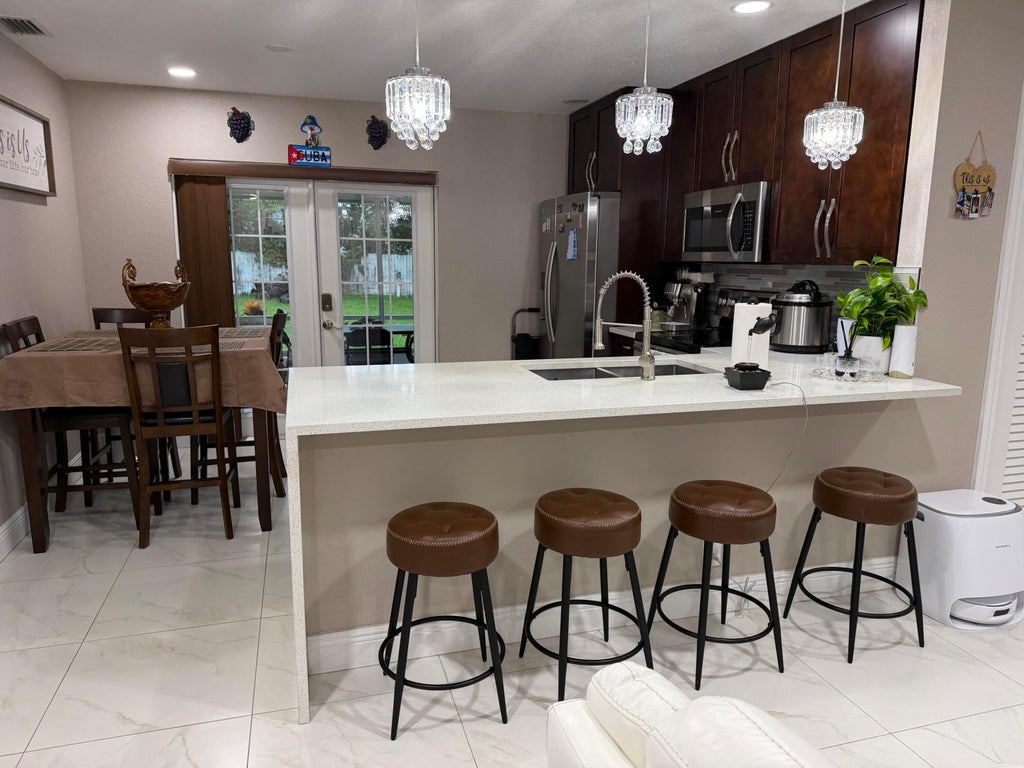 Photo of 4307 CYPRESS Lane, Palm Springs, FL 33406 (MLS # B26078402)