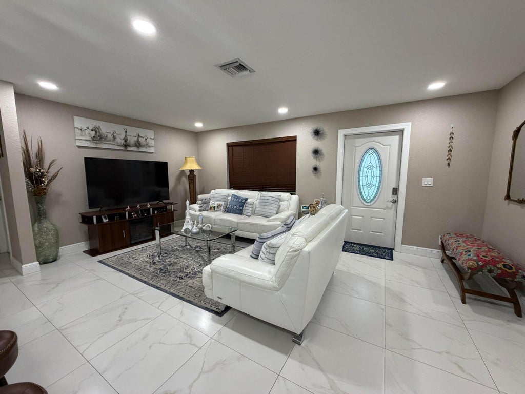 Photo of 4307 CYPRESS Lane, Palm Springs, FL 33406 (MLS # B26078402)