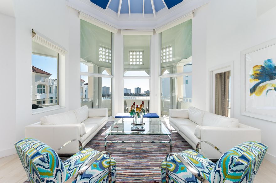 Enjoy the East (Ocean), West (Sunset) views of this Mizner TOWER PENTHOUSE with soaring 22-foot ceilings, an exceptional blend of luxury, privacy, and the coveted waterfront lifestyle on the grounds of The Boca Raton. This 3-bedroom, 4.5-bath residence offers 2,544 livable square feet designed to maximize comfort, light, and seamless entertaining.

A corner residence flooded with natural light, it features NEW full impact hurricane windows and doors, newer 2 Zone HVAC, a gourmet kitchen, and an expansive wraparound balcony where you can start your mornings with sunrise ocean breezes and unwind with sweeping Lake Boca, Ocean, Intracoastal, golf course, and city views. Impeccably maintained after a high-quality designer renovation, the home offers timeless modern elegance the moment you e Designer furnishings negotiable for a truly turnkey experience.

The split-bedroom layout provides privacy for you and your guests, with a serene primary suite offering double walk-in closets and luxurious His and Her baths, your personal retreat after a day at the beach, golf, boating, or enjoying the resort amenities just outside your door.

Located within the private, gated grounds of The Boca Raton Resort & Club, you'll enjoy unmatched walkability to world-class dining, the beach, shopping, and downtown attractions, making everyday living feel like a 5-star vacation. (Resort membership not included.)

Mizner Tower is a pet-friendly, full-service building offering valet, concierge, security, pool w/towel service, fitness center, tennis, lounge with lite snacks and marina access, everything you need to live the effortless, resort-style East Boca lifestyle you've been searching for.