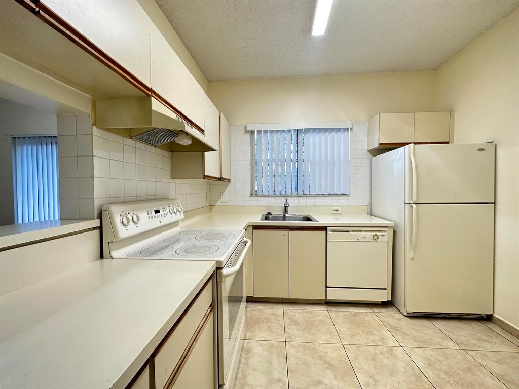 Photo of 631 Cypress Lake Boulevard #C, Deerfield Beach, FL 33064 (MLS # R11095283)