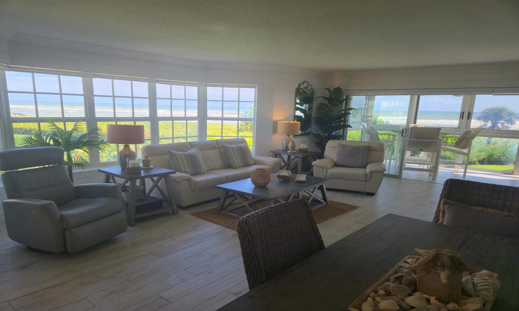 Gorgeous renovated 2/2 second floor northeast corner condo in beautiful Juno Beach. Sweeping 180 degree views of the beach and the amazing Atlantic ocean. Open plan decorated in Coastal Chic and turn key. Located on peaceful Pelican Lake with a 360 degree walking pathconnecting to the sidewalk that takes you to the Juno Pier. Walking distance to 10 plus restaurants and bars.  Close to shopping and just 15 minutes to I-95 and the Turnpike.  Spend your season enjoying all that Juno Beach has to offer.