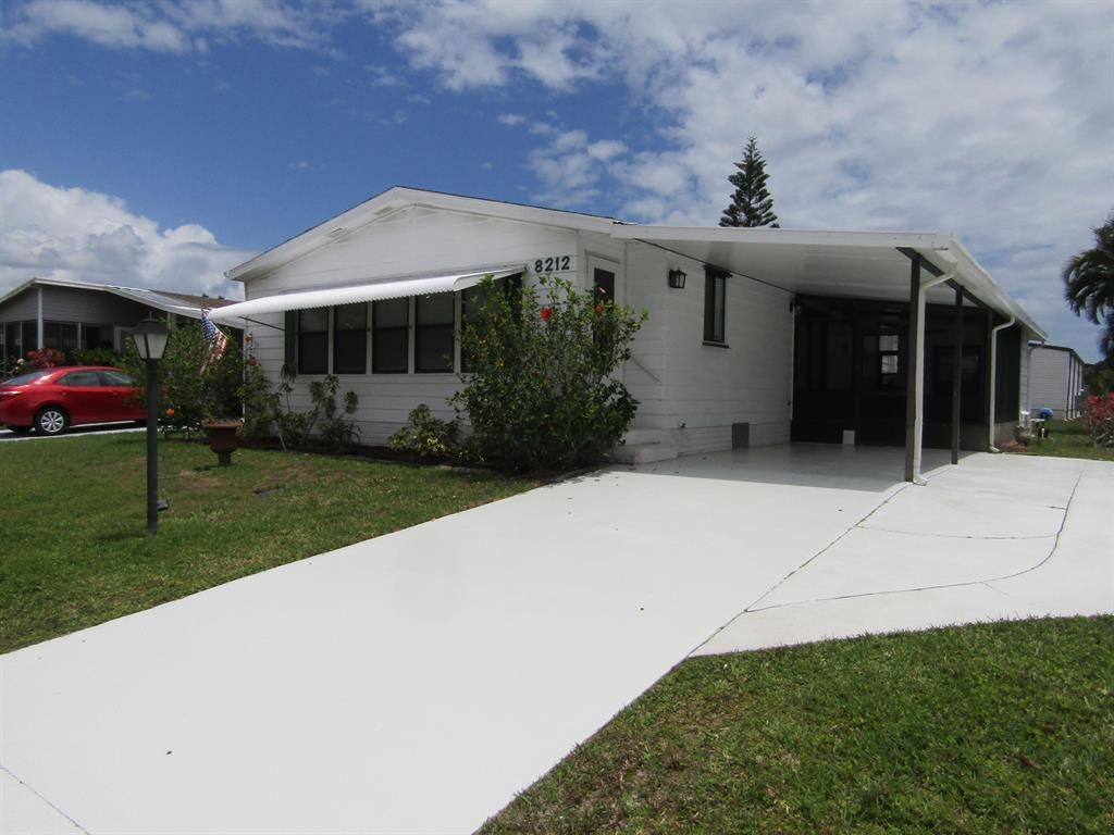 Photo of 8212 W Bitterbush W Lane, Port Saint Lucie, FL 34952 (MLS # R10712501)