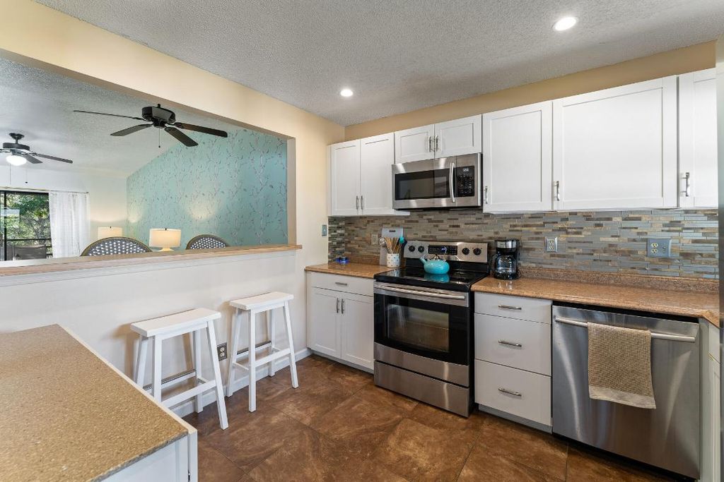 Photo of 1210 SE Parkview Place #E9, Stuart, FL 34994 (MLS # R10941487)