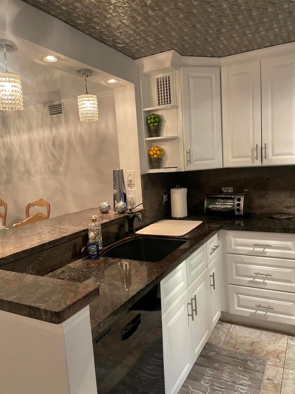 One-of-a-Kind Waterfront 2/2 Corner Condo in Premier 55+ Community - Wynmoor.Step into luxury with this spectacular, fully upgraded 2-bedroom, 2-bathroom corner unit located on the first floor of the highly sought-after Wynmoor 55+ community. This unique home offers stunning water views from nearly every room and exudes the feeling of being on a private retreat the moment you walk in.The open-concept design showcases a modern chef's kitchen with oversized cabinets, marble countertops and backsplash, high-end stainless steel appliances, and a stylish bar area with designer lighting--perfect for entertaining. The open layout flows effortlessly into a spacious living area with a custom reflective ECO-ceiling, enhancing the natural light and highlighting the serene lake views.