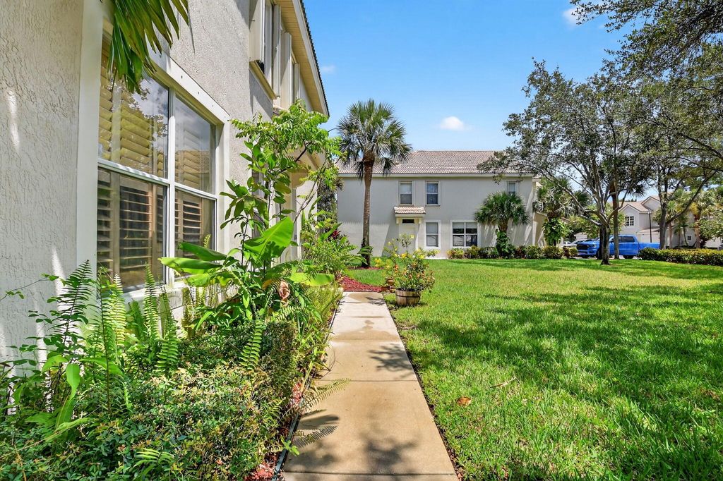 Photo of 1091 Woodfield Road, Greenacres, FL 33415 (MLS # R11112865)