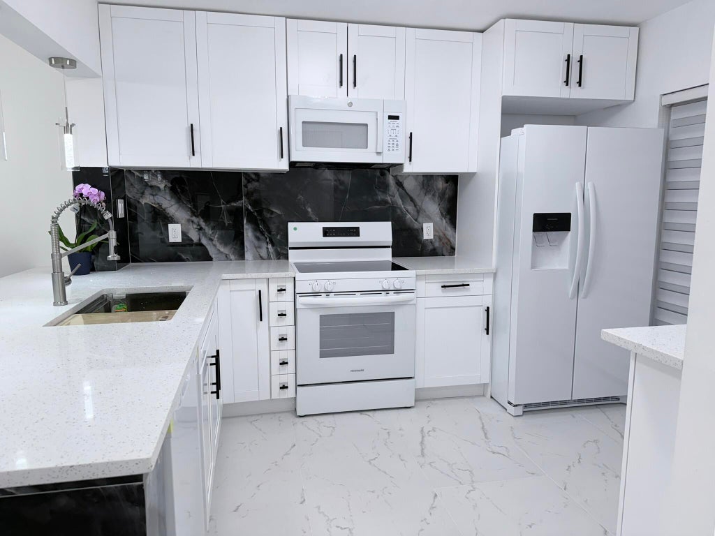 Photo of 300 E Club Circle #107, Boca Raton, FL 33431 (MLS # B26044168)