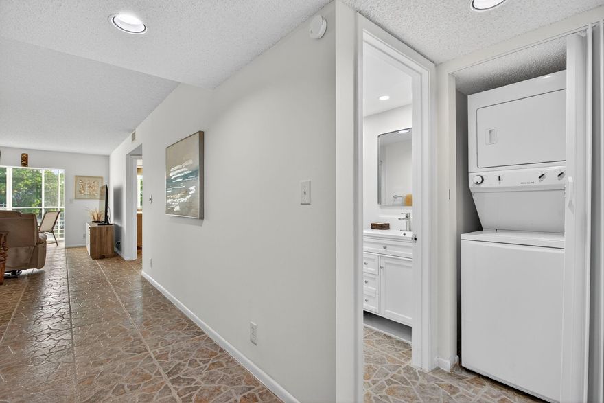 Beautiful Water View 2/2 Impact Windows Updated Washer & Dryer Condo in Wynmoor Golf Village. Resort-Style Living at Its Best! Highly sought-after community, offering a perfect blend of Comfort & Style. Bright & Airy Remodeled unit, move-in ready, tastefully decorated, ideal for year-round living or a seasonal escape. Unique benefits featuring enclosed Balcony overlooking the water that floods the space with Natural Light & provides Serene Views of the Lake and Fountain. The Enclosed Balcony-perfect for morning coffee or evening relaxation. Kitchen boasts Updated Appliances, & a Custom Wall Feature with a Pass Through. Gated community-residents enjoy a wealth of amenities like a Championship Golf Course, Restaurant, fitness center, pools, theater, pickleball, courtesy transportation & more