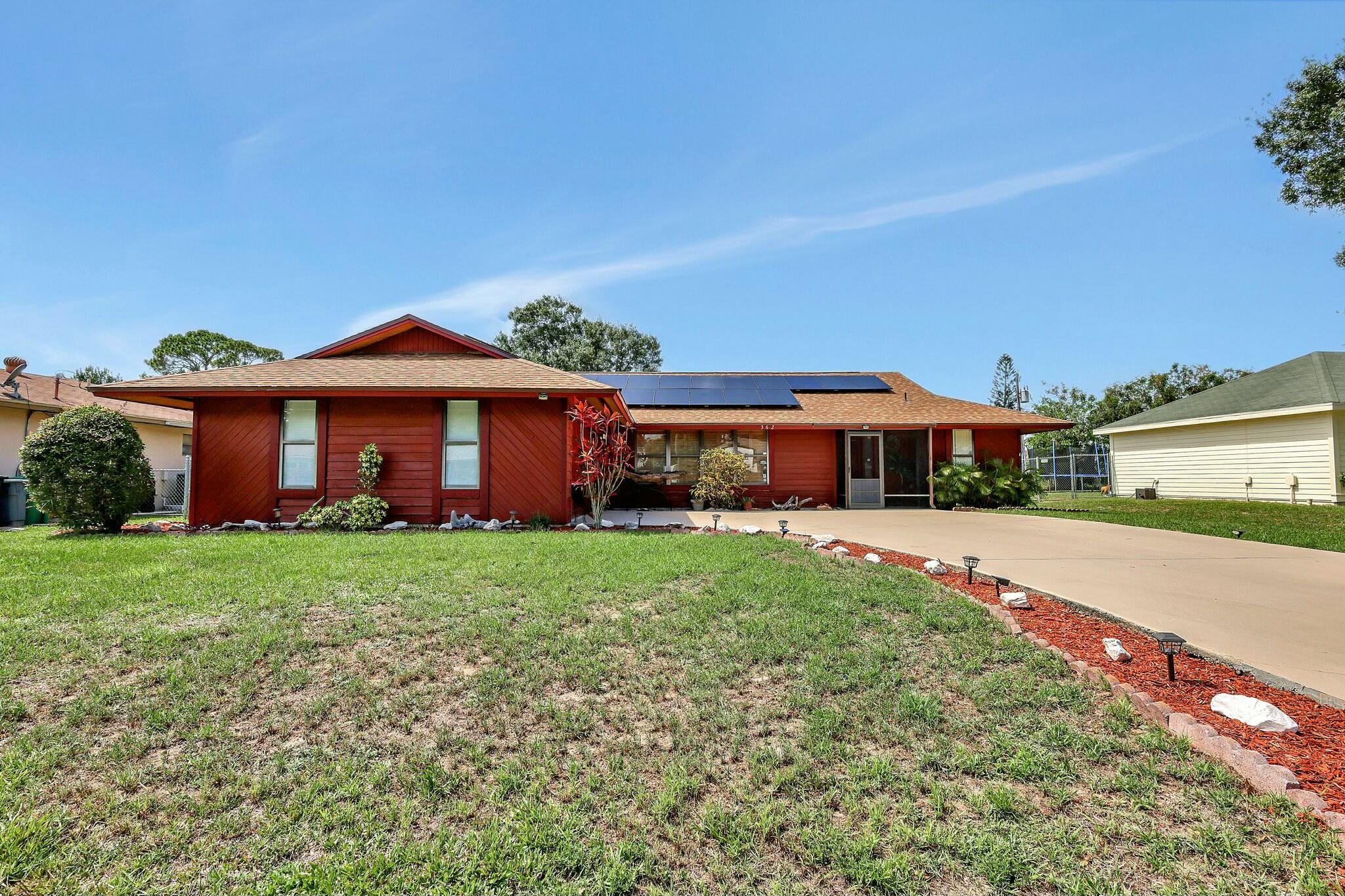 This beautiful unfurnished home offers a 3-bedroom, 2-bathroom layout with a 2-car garage and 2,250 sq ft of living space. The property boasts excellent curb appeal with meticulously maintained landscaping, a fresh coat of paint, and an oversized driveway. Inside, enjoy the open and airy ambiance created by vaulted ceilings, and a spacious family/great room. The kitchen is a chef's dream, complete with stone countertops, a farmhouse sink, a built-in Sub-Zero refrigerator, dual convection ovens with a warming drawer, a five-burner induction cooktop, and a microwave drawer on the kitchen island. Outside, you will find a fully fenced backyard, new roof and solar panels which saves money on electricity costs. This home is located near shopping, dining, and the Florida Turnpike.
