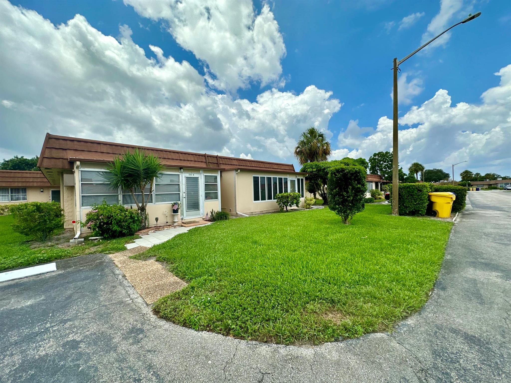 Spacious and beautifully maintained 2-bedroom, 2-bath condo located in a very desirable neighborhood within Kings Point, a premier 55+ manned gated community in Delray Beach. This inviting unit features an enclosed patio perfect for relaxing or entertaining, a modern kitchen with granite countertops and newer appliances, and tastefully chosen warm neutral tones throughout. Both bathrooms offer stand-up showers, adding comfort and convenience.Ideally situated just a short walk from the clubhouse, residents enjoy easy access to Kings Point's impressive amenities, including multiple heated pools, golf courses, on-site restaurants, tennis courts, bocce ball, fitness center, theater with live entertainment, and a vibrant calendar of social activities and clubs.