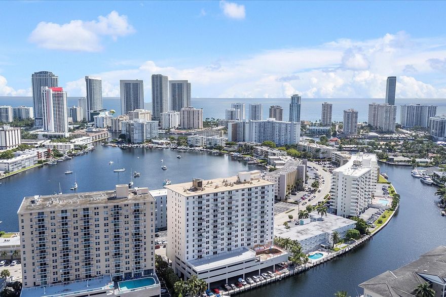 Breathtaking views surround this penthouse condo, showcasing the ocean, bay, and city skyline. Watch boats glide by and enjoy sparkling city lights at night. This 1-bedroom, 2-bath residence includes a versatile den, generous living room, large bedroom, ample closet space, and impact windows. Offered turnkey and move-in ready.
The well-kept building offers a heated pool, fitness room, secured lobby entrance, and garage parking. With no age restrictions, it suits all lifestyles.
Ideally located, you are just steps from shopping, dining, and the beach, with easy access to airports, seaports, and the best of South Florida living.