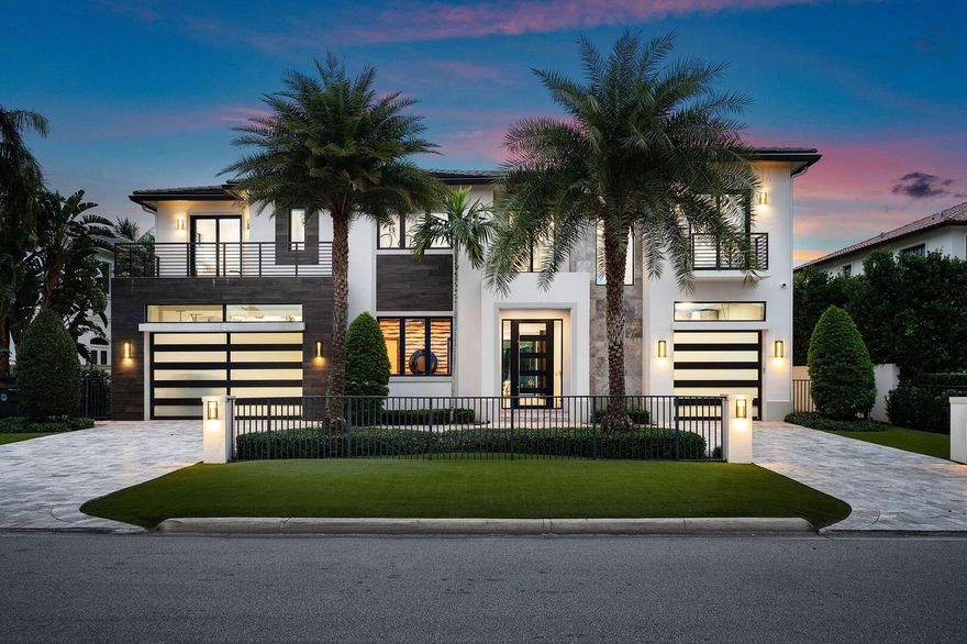 Introducing 2324 Date Palm Road, an architectural triumph by Primo Construction and Cosentino Architecture, located in the prestigious Royal Palm Yacht & Country Club. This extraordinary 2020 estate showcases Italian luxury craftsmanship, blending modern design with unparalleled attention to detail.The home embraces the outdoors with two covered terraces and seamless indoor/outdoor living. Floor-to-ceiling sliding glass doors flood the interiors with natural light and offer breathtaking views of the resort-style saltwater pool. This private oasis features a sun shelf, water sprays, and a spa, creating the ultimate retreat. The terraces are designed for entertaining, with a summer kitchen, built-in 48'' BBQ, stone fireplace, and mounted television.
