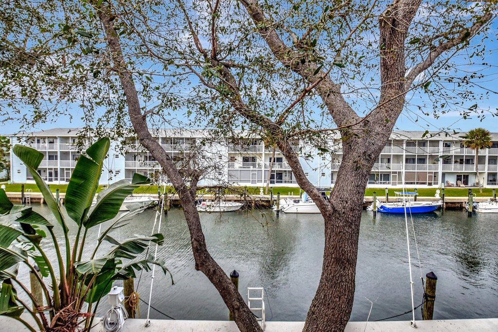 Photo of 1125 Lake Shore Drive #203, Lake Park, FL 33403 (MLS # R11123962)