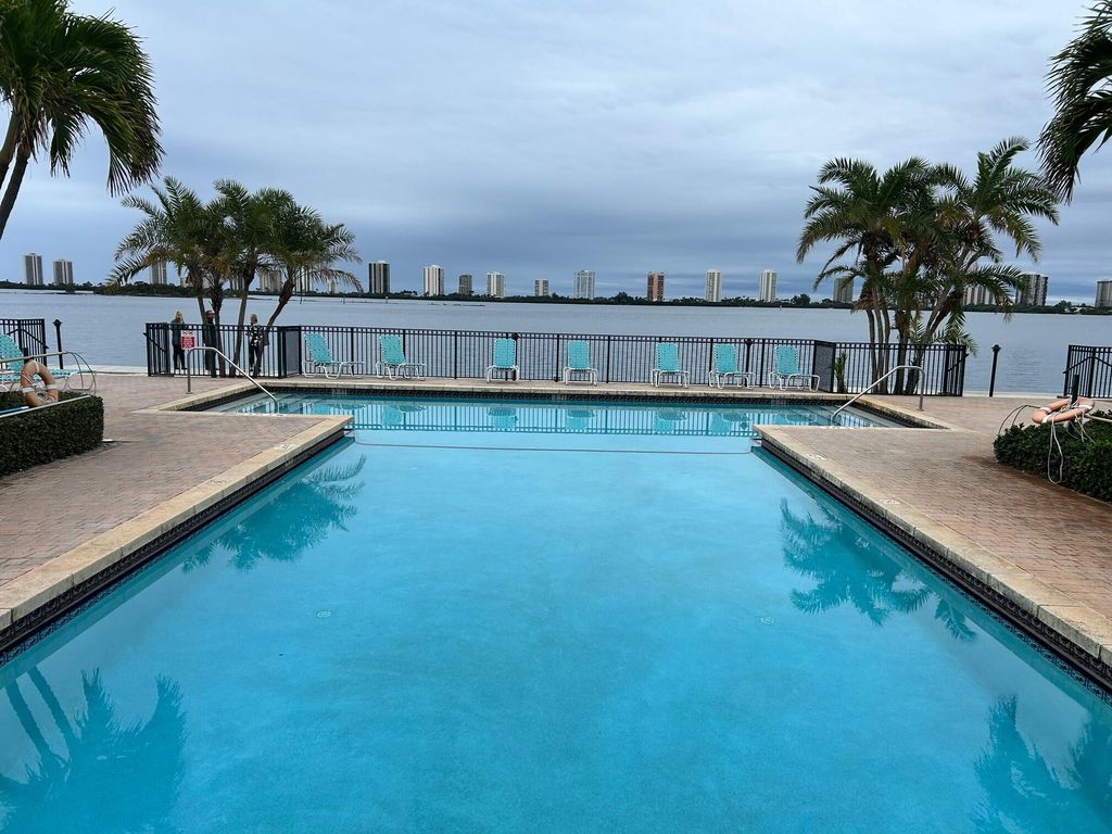 Photo of 1125 Lake Shore Drive #203, Lake Park, FL 33403 (MLS # R11123962)