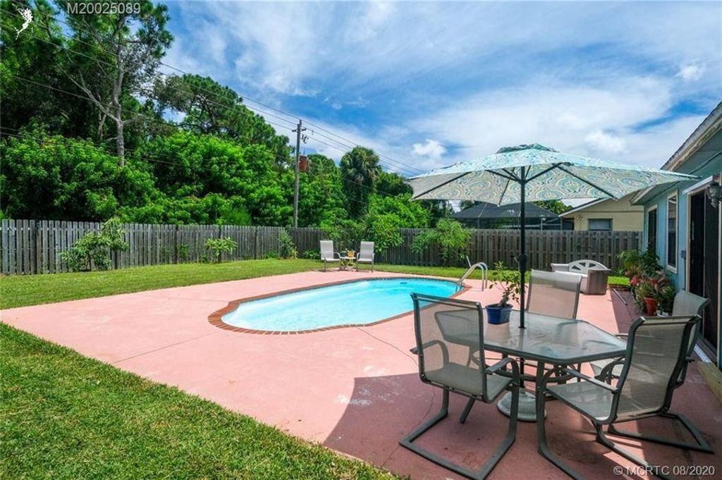 Photo of 4063 SE Jacaranda Street, Stuart, FL 34997 (MLS # R11122612)