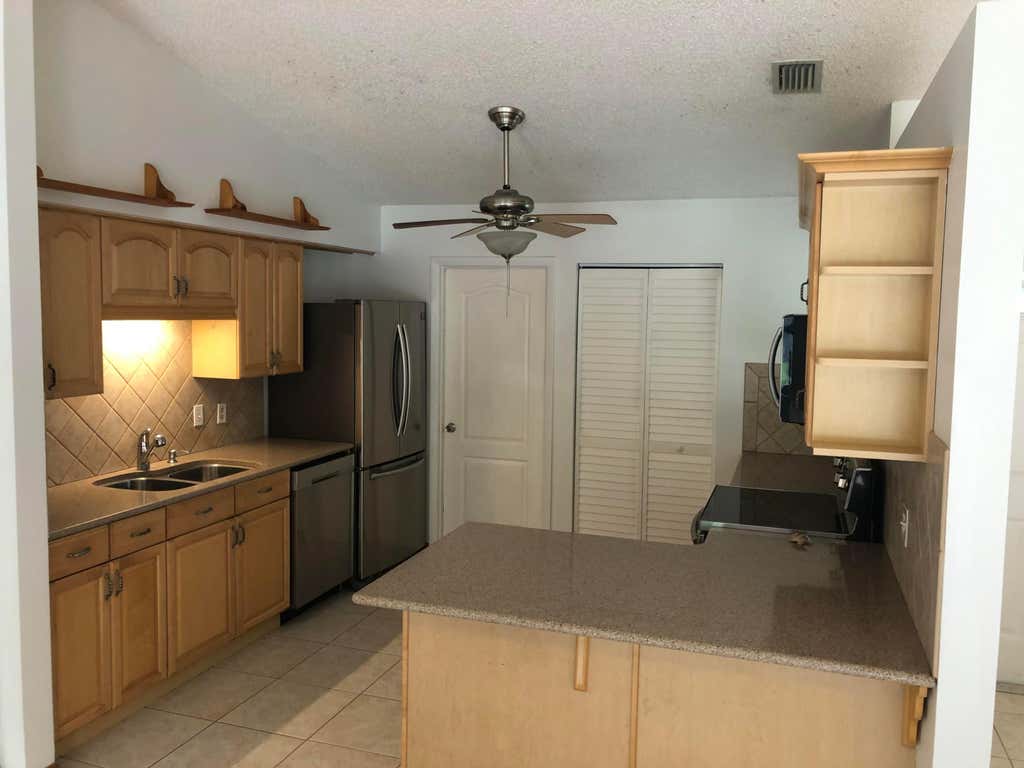 Photo of 4063 SE Jacaranda Street, Stuart, FL 34997 (MLS # R11122612)