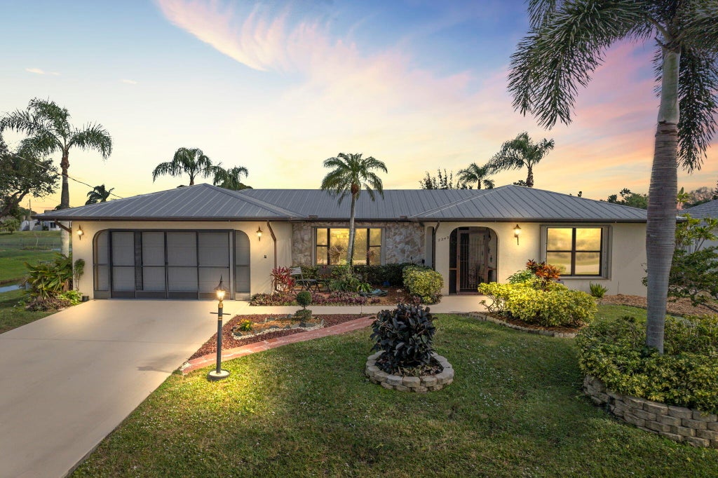 Photo of 2249 SE Leithgow Street, Port Saint Lucie, FL 34952 (MLS # R10955534)