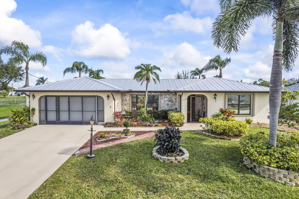 Photo of 2249 SE Leithgow Street, Port Saint Lucie, FL 34952 (MLS # R10955534)