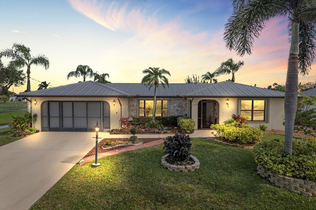 Photo of 2249 SE Leithgow Street, Port Saint Lucie, FL 34952 (MLS # R10955534)