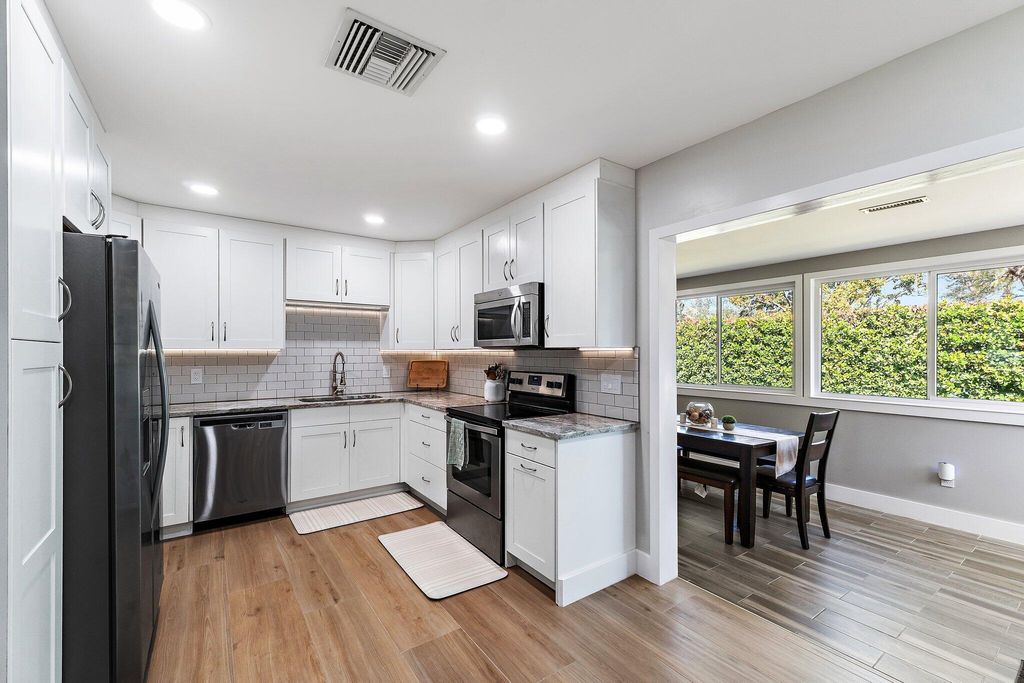 Photo of 8913 SE Sandridge Avenue, Hobe Sound, FL 33455 (MLS # B26006217)