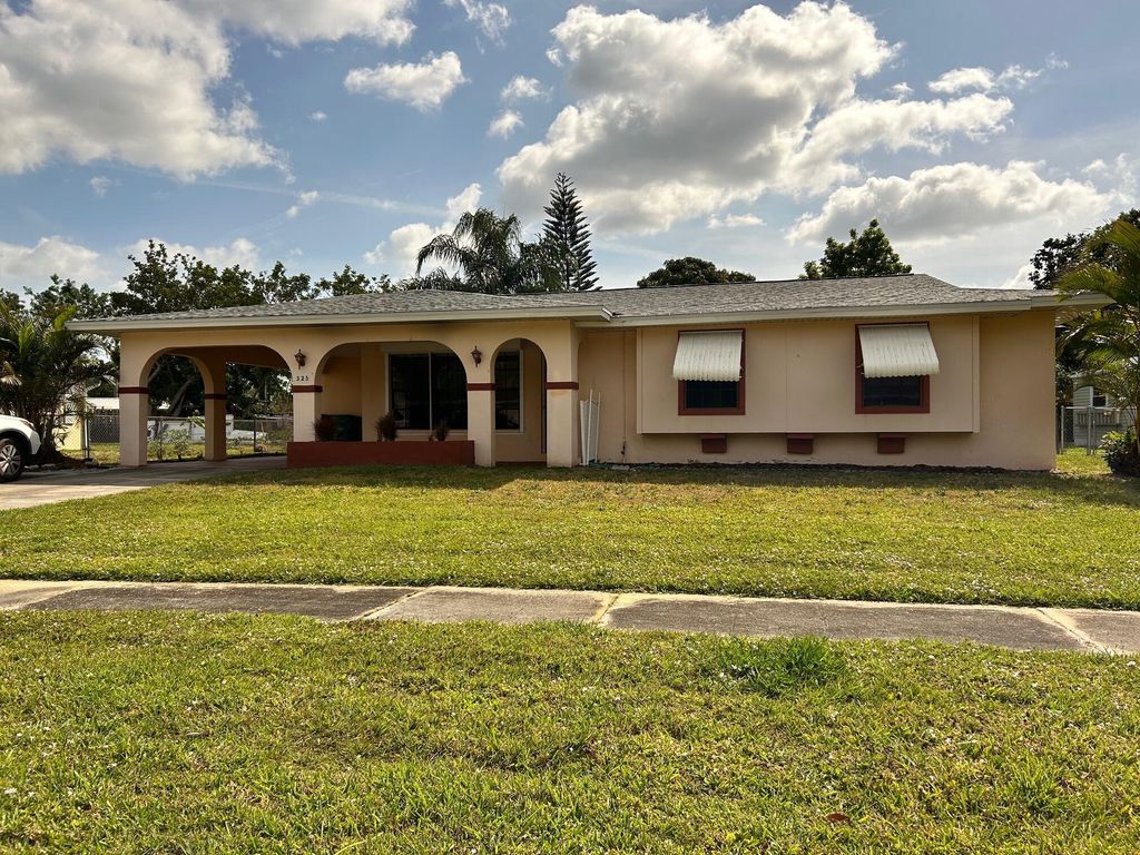 Photo of 325 NE Orchard Street, Port Saint Lucie, FL 34983 (MLS # R11083580)