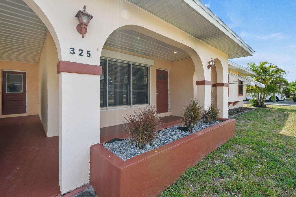 Photo of 325 NE Orchard Street, Port Saint Lucie, FL 34983 (MLS # R11083580)