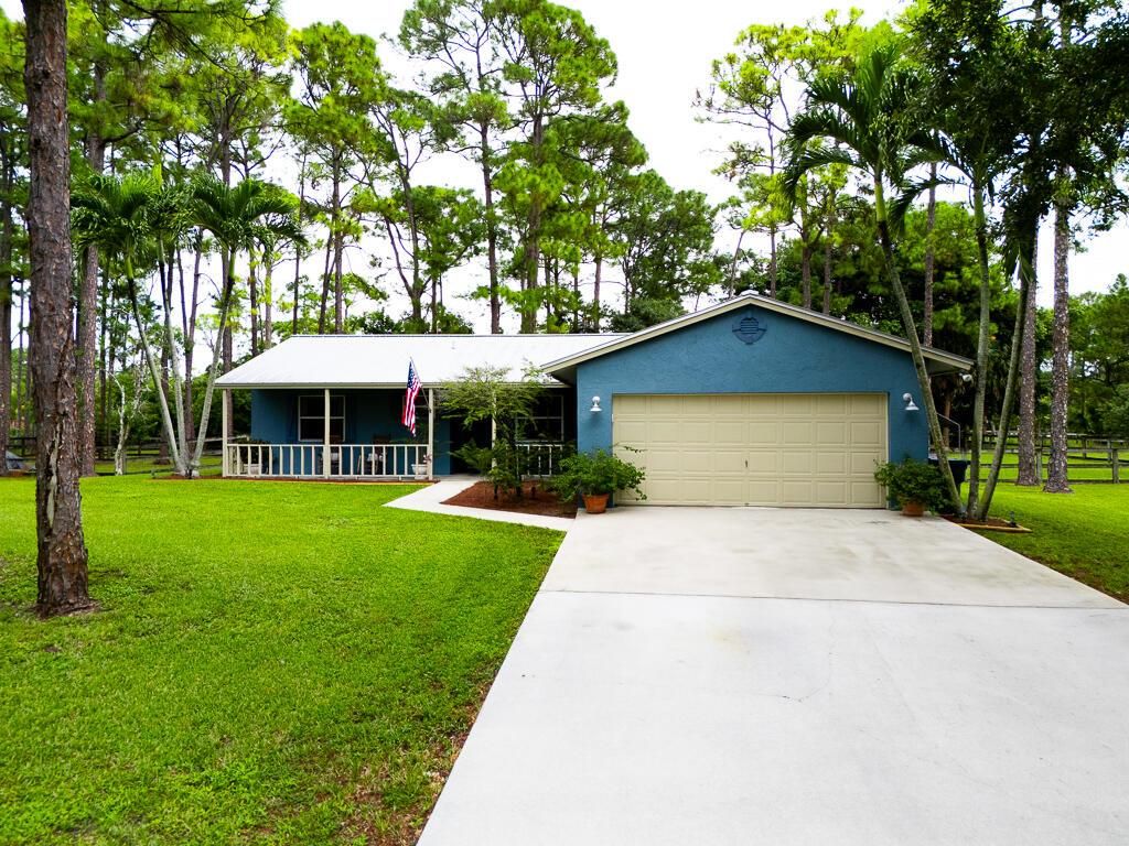 Photo of 15733 Temple Boulevard, Loxahatchee, FL 33470 (MLS # R11125970)