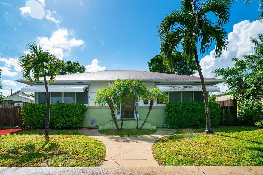 Discover a versatile income producing investment in the heart of Lake Worth Beach! This fully fenced duplex offers both charm and functionality, featuring a 1-bedroom/1-bath cottage rented for $1,600 per month and a 3-bedroom/1-bath home rented for $2,450 on one lot. Both units are equipped with new AC systems, newer roofs, and in-unit washer and dryer for modern comfort.Located just minutes from the beach and vibrant downtown, this property is ideal for seasoned investors seeking strong rental income or for new investors who want to live in one unit while generating income from the other.With its prime location and move-in-ready features, this duplex is a rare find in today's market.