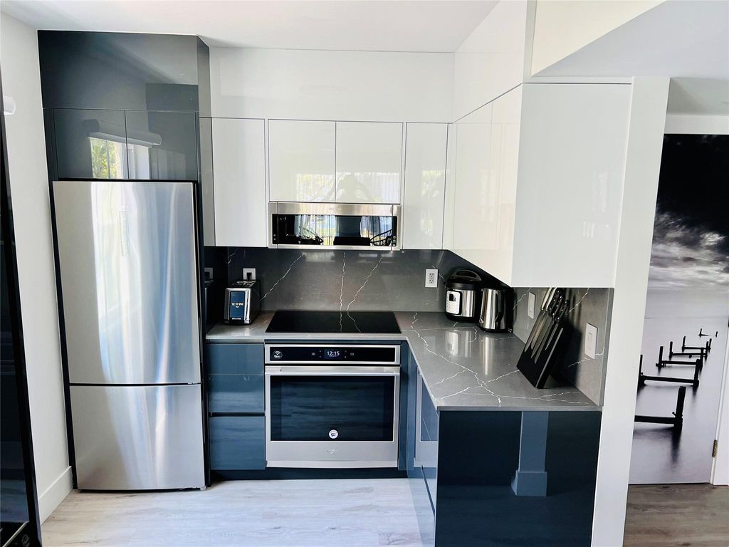 Photo of 1105 Lake Shore Drive, Lake Park, FL 33403 (MLS # F10396767)