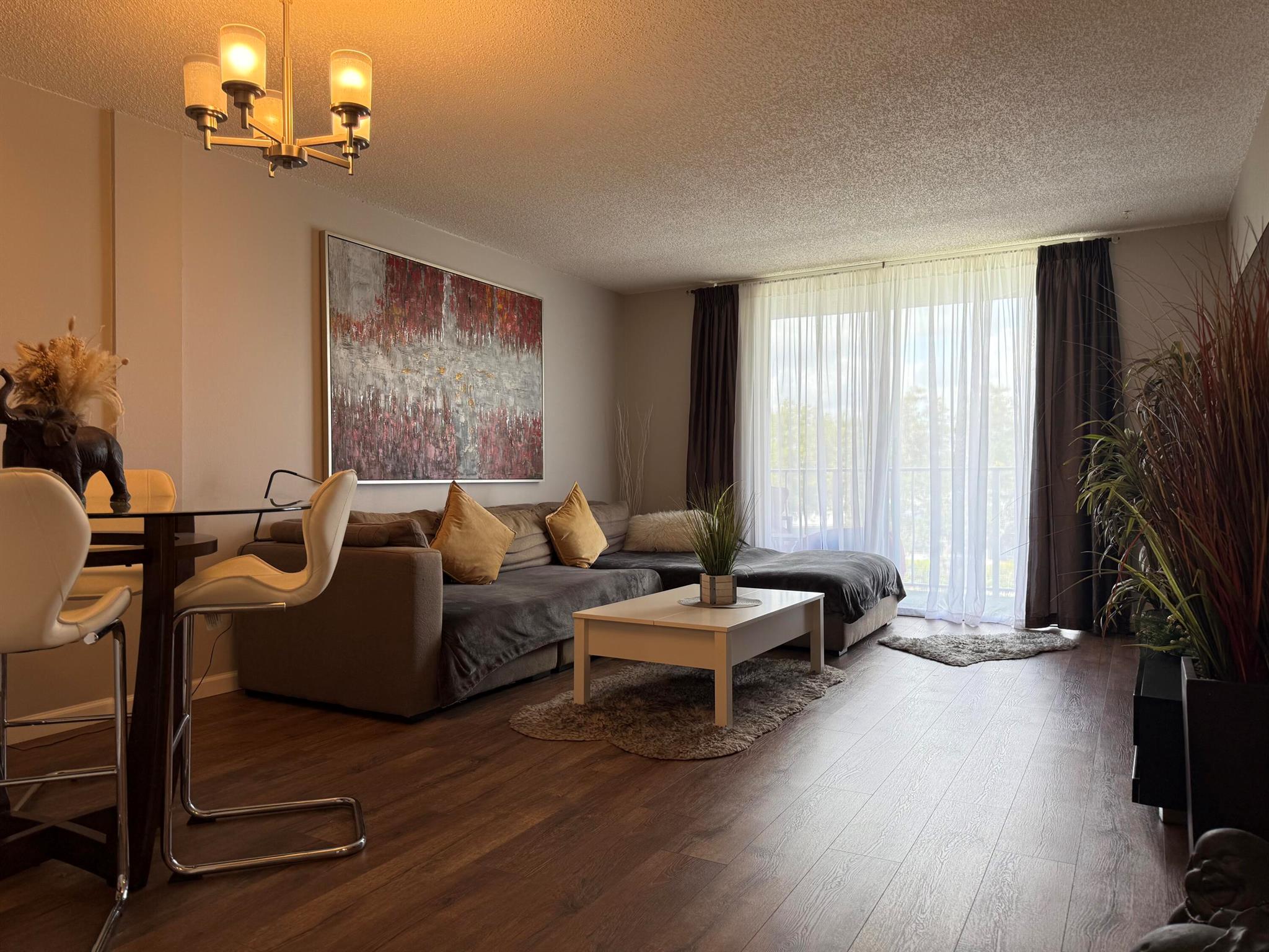 Welcome to this inviting and fully furnished 1-bedroom, 1-bath condo perfectly situated for easy access to major highways, shopping, and dining, this condo offers an ideal blend of comfort and convenience.Inside, you'll find a well-designed open living space that seamlessly connects the kitchen and living area. The kitchen is equipped with ample storage, making meal prep a breeze. The spacious bedroom features generous closet space, and the updated bathroom offers both style and functionality.