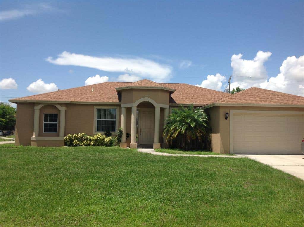 Photo of 1899 SW Dalmatian Avenue, Port Saint Lucie, FL 34953 (MLS # R10733027)