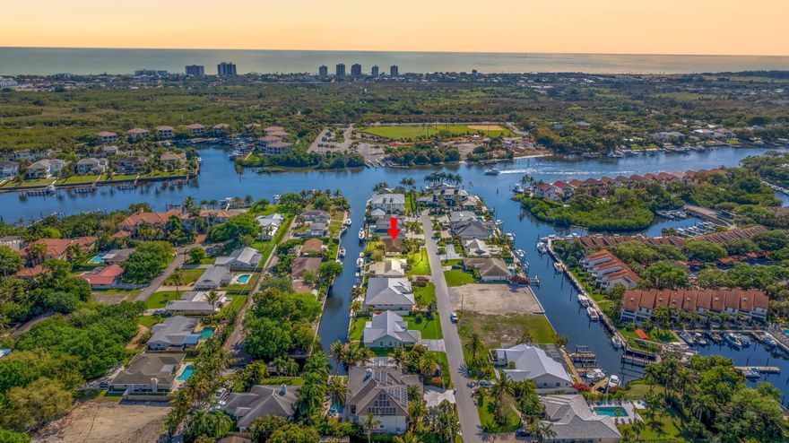 Rare opportunity to build on a .29-acre deepwater lot with 100 feet of waterfront just a few lots from the Intracoastal. No HOA, no fixed bridges, and a good seawall make this an ideal property for boaters. Located on the desirable south side of Edward Road, with a deep, well-maintained inlet that can accommodate a large vessel. New sewer lines recently installed for easy tie-in. Excellent location just south of Donald Ross Road and minutes to the beach, dining, and shopping.