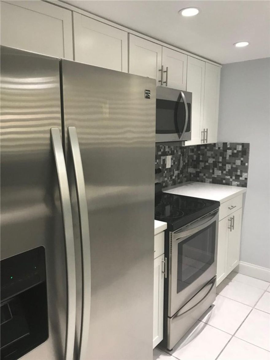 Spacious 2 Bed 2 Bath with a screened-in patio, single-story condo located in the community of Patios of Oakwood. The condo features an updated kitchen with stainless steel appliances, Quartz countertops, a designated breakfast area, tile floors throughout, a screened patio with a storage room, a full-size washer and dryer, and more. Located in the Heart of Coral Springs. The community features its own pool. Association requires 700 or higher credit scores and income 3 times the rent.